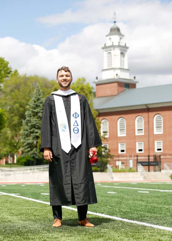 a man in a graduation gown