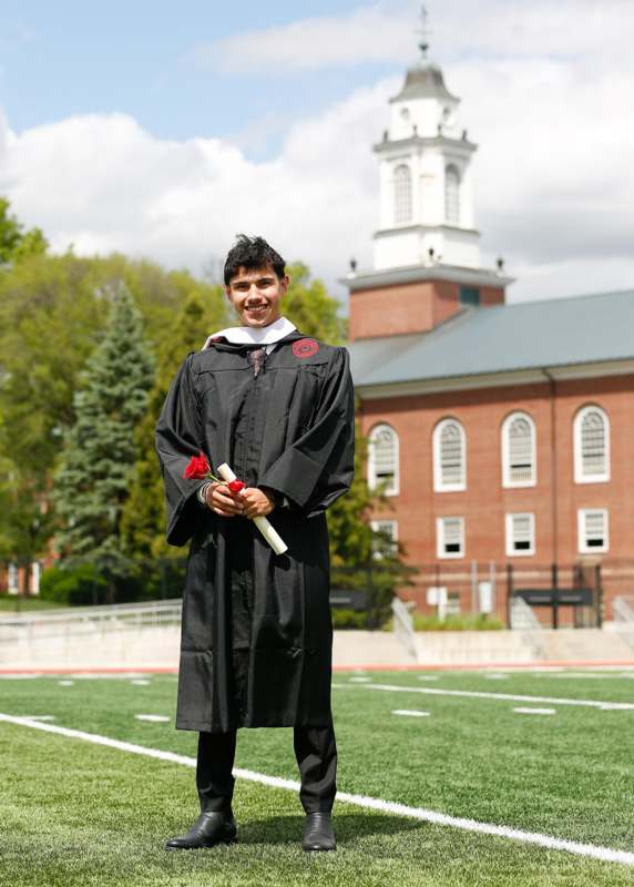 a man in a graduation gown