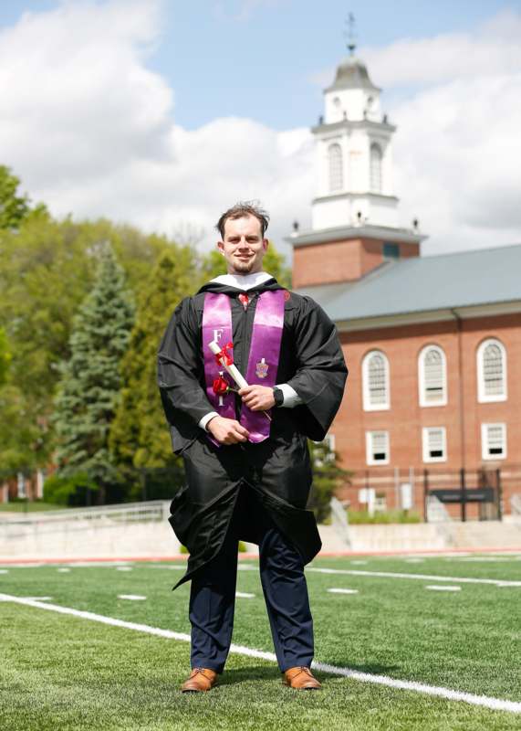 a man in a graduation gown
