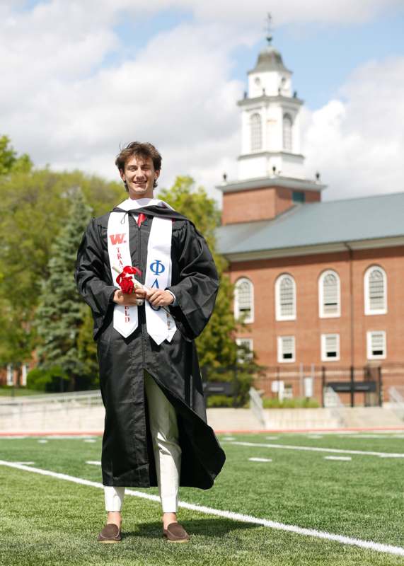 a man in a graduation gown
