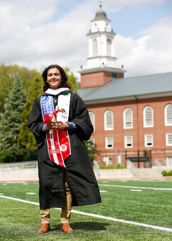 a man in a graduation gown
