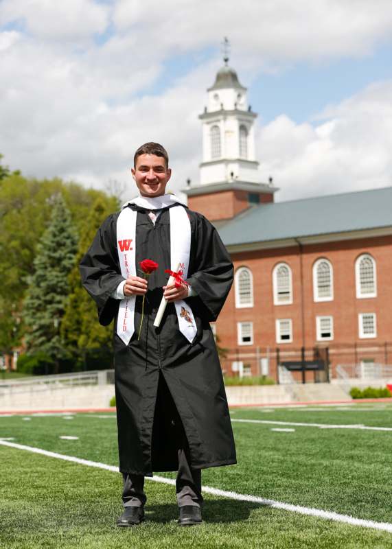 a man in a graduation gown