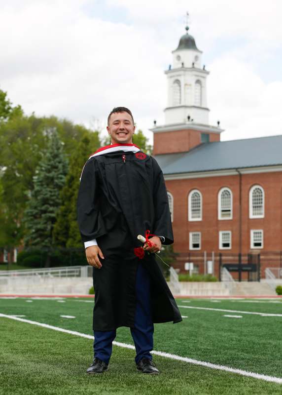 a man in a graduation gown