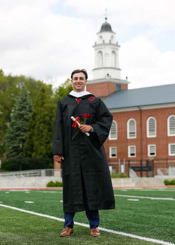 a man in a graduation gown