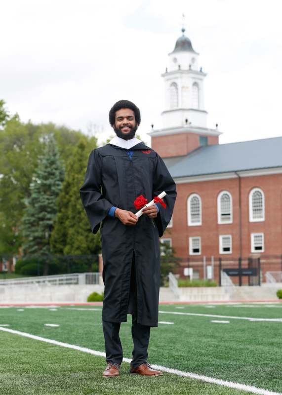a man in a graduation gown