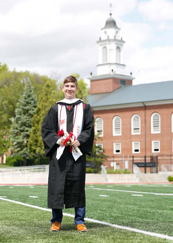 a man in a graduation gown