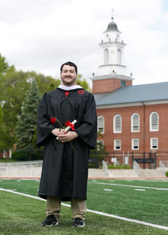 a man in a graduation gown