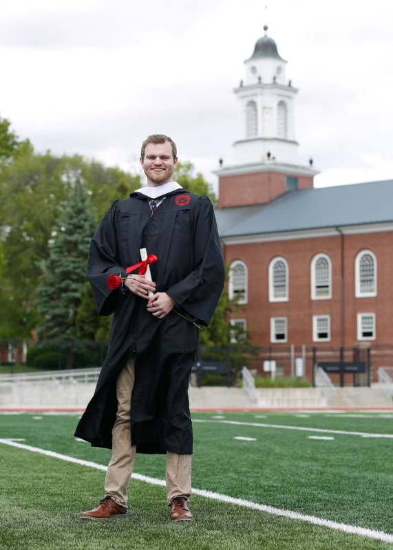 a man in a graduation gown