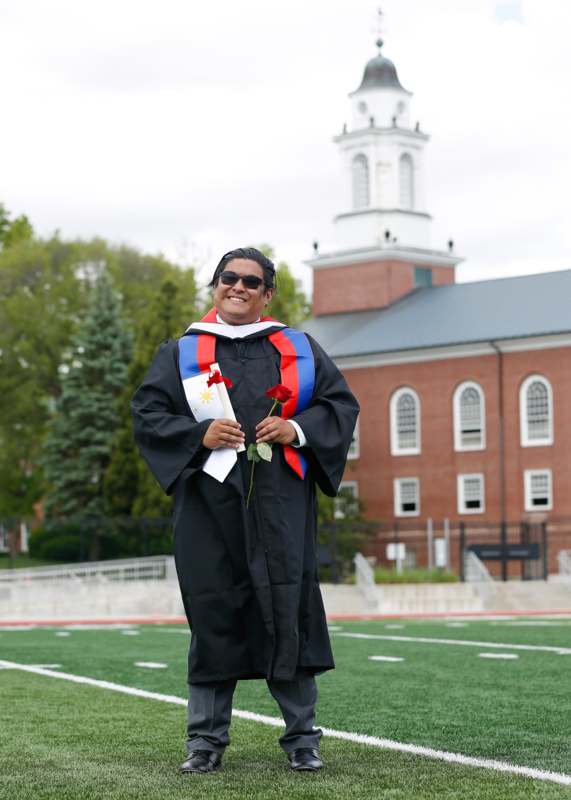 a man in a graduation gown