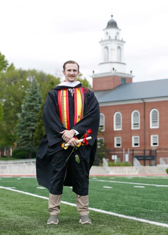 a man in a graduation gown
