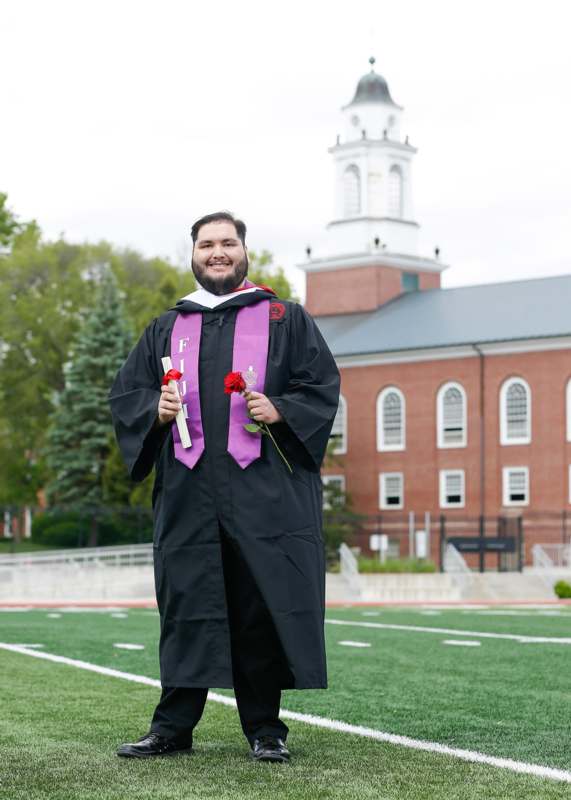 a man in a graduation gown