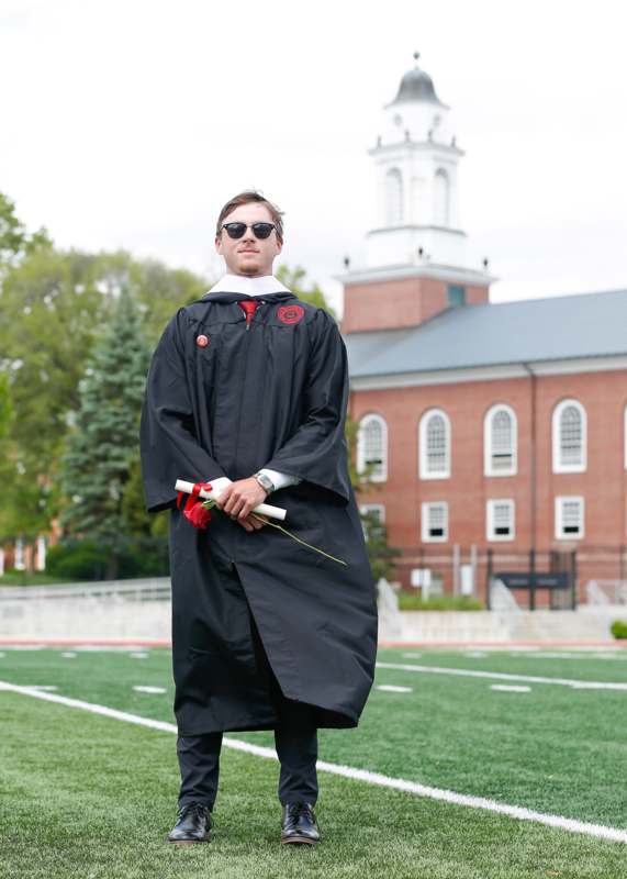 a man in a graduation gown