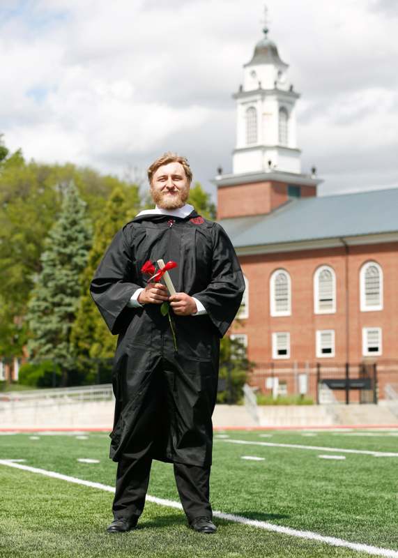a man in a graduation gown