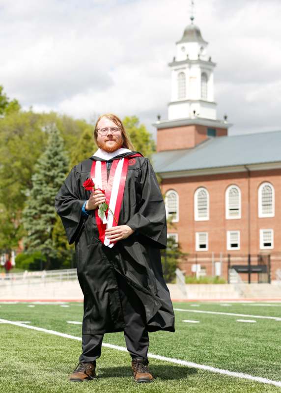 a man in a graduation gown