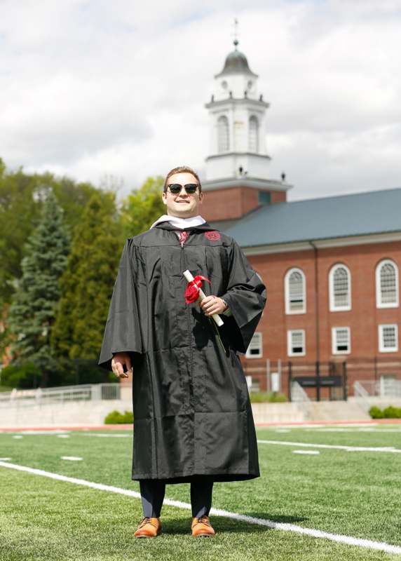 a man in a graduation gown