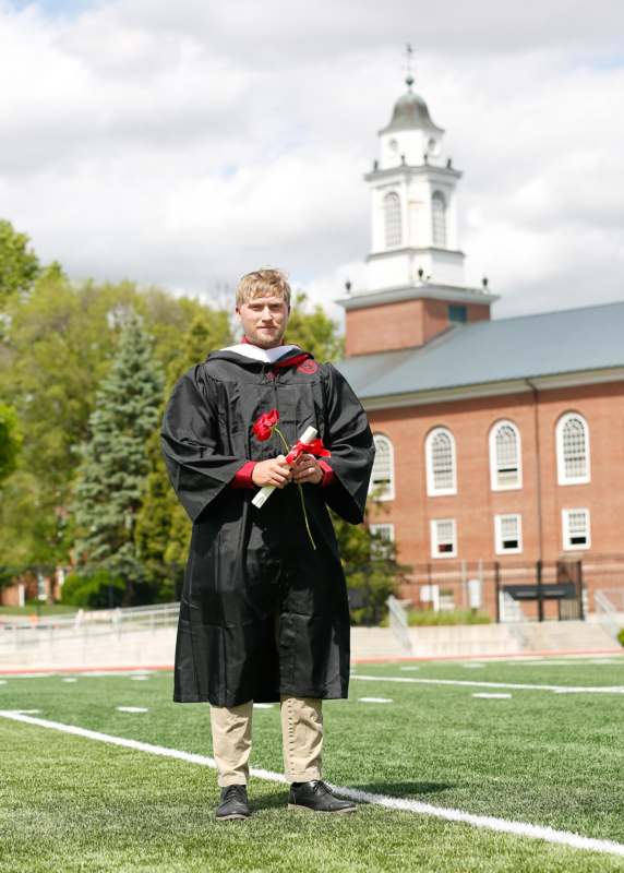 a man in a graduation gown