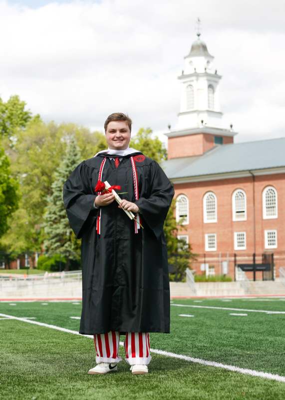 a man in a graduation gown