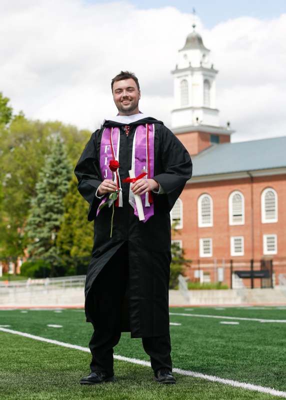 a man in a graduation gown