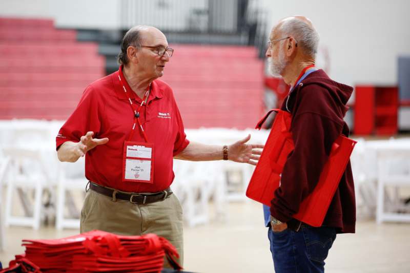a man talking to another man