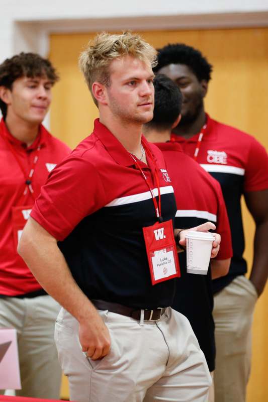 a group of men wearing red shirts