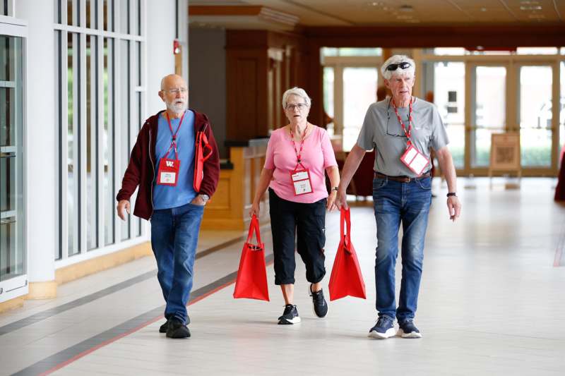 a group of people walking in a building