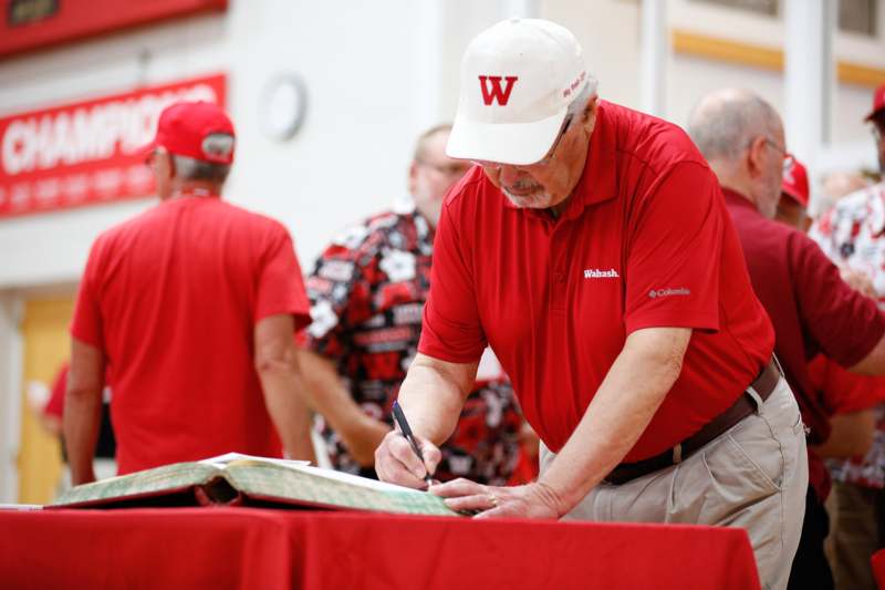 a man signing a book