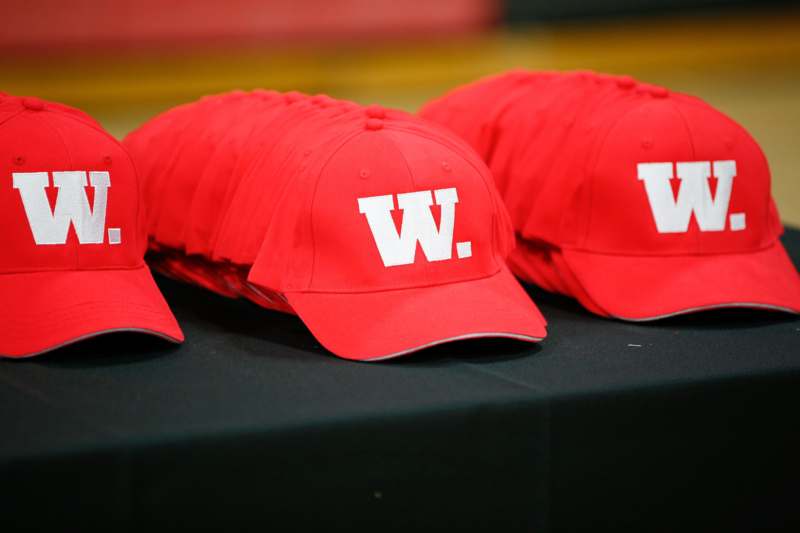 a group of red hats on a table