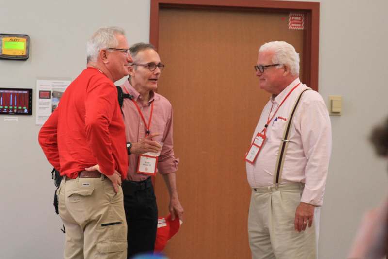 a group of men standing in a room