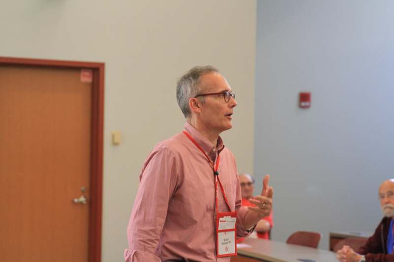 a man in a pink shirt