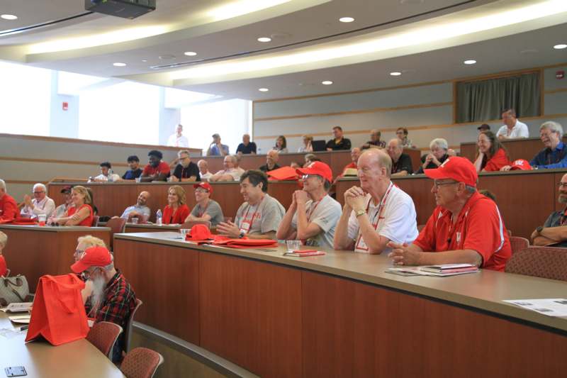 a group of people in a lecture hall
