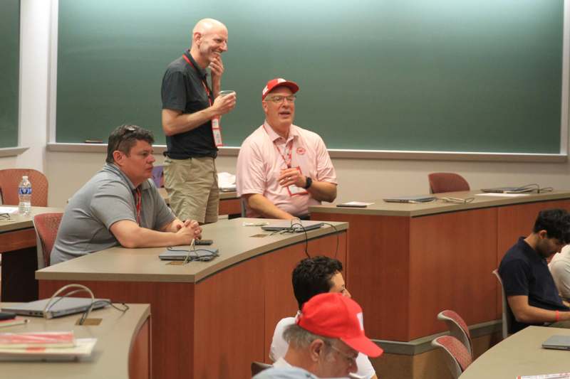 a group of men in a classroom