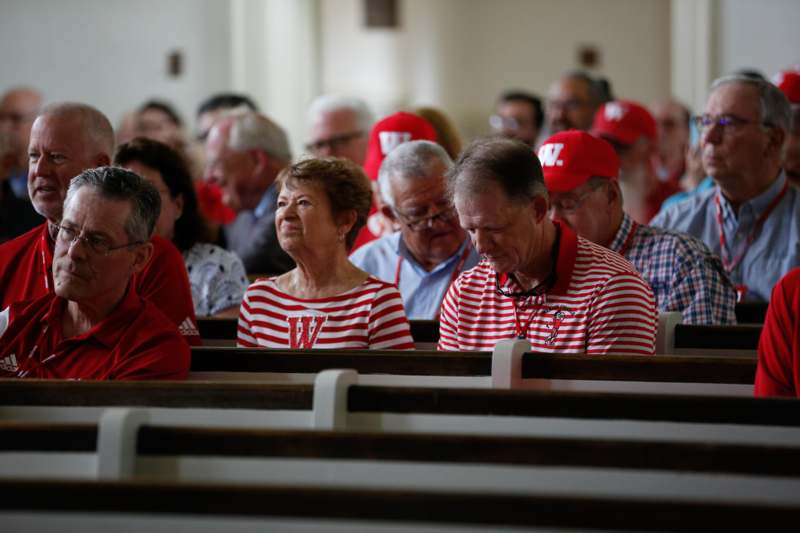 a group of people sitting in a church
