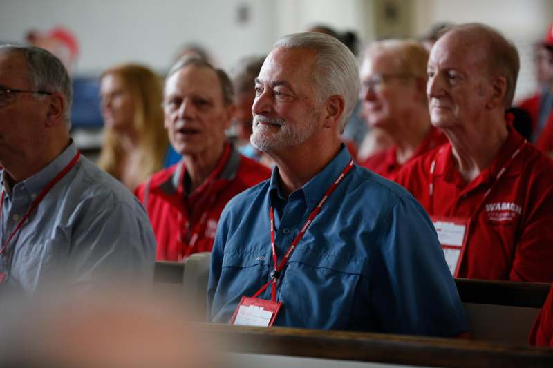a group of people sitting in pews