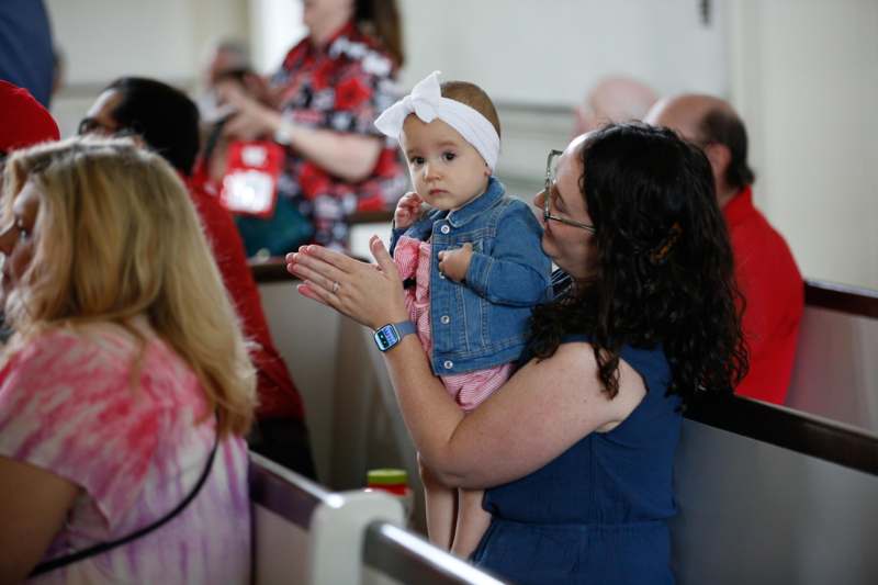 a woman holding a baby