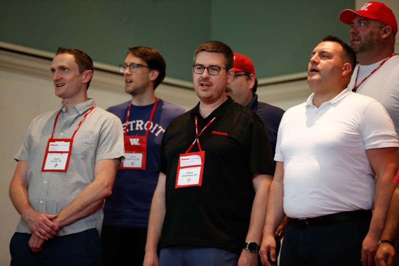 a group of men wearing badges