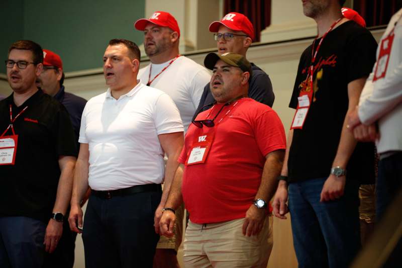 a group of men standing in a room