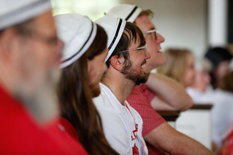 a group of people sitting in a row