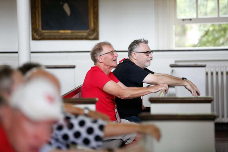 a group of people sitting in a church
