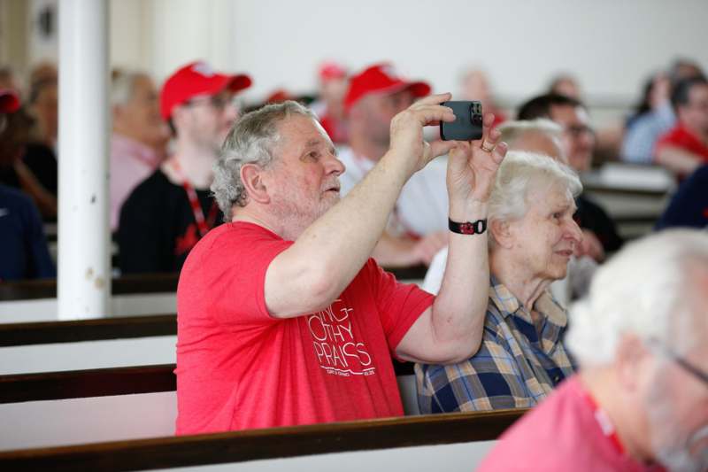 a man taking a picture of a group of people