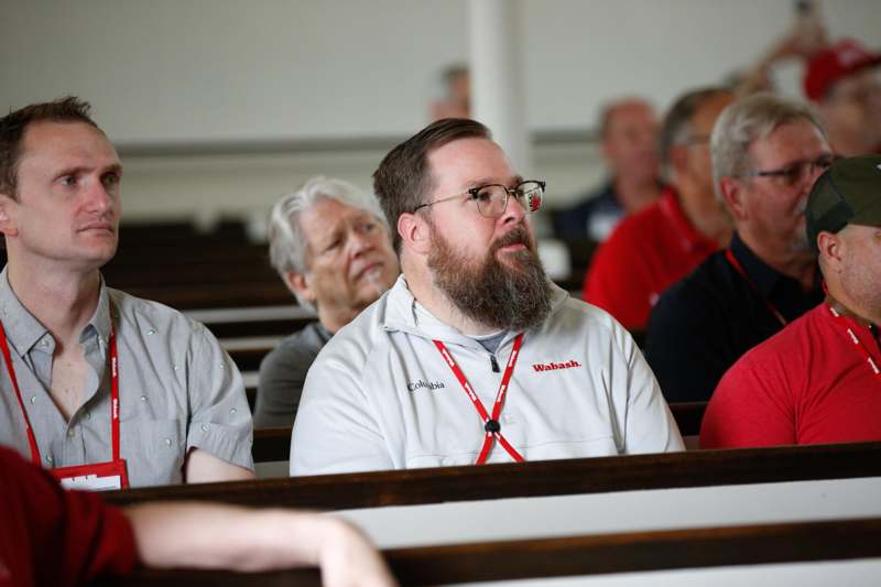 a group of people sitting in pews