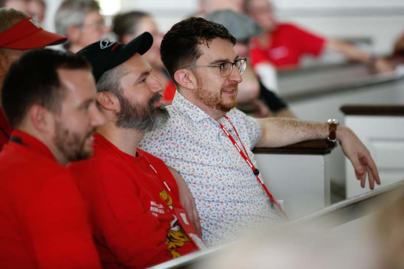 a group of men sitting in a room