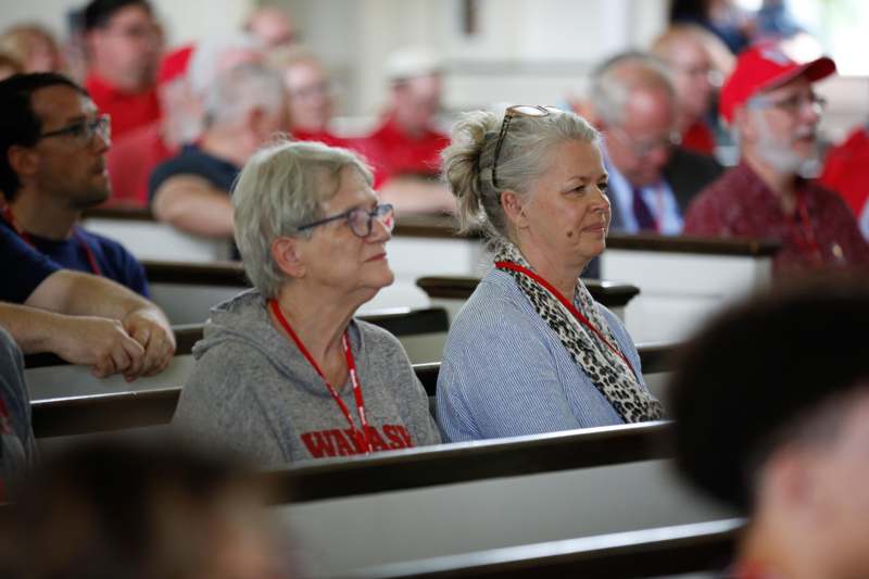 a group of people sitting in pews