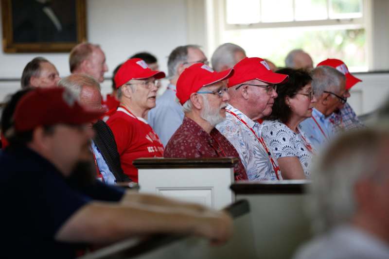 a group of people sitting in a church