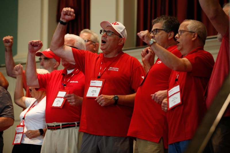a group of men wearing red shirts