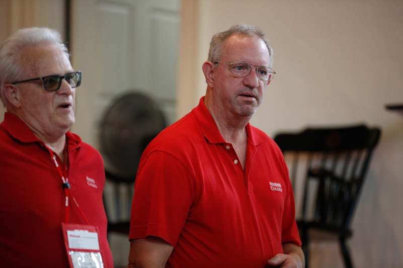 a group of men wearing red shirts