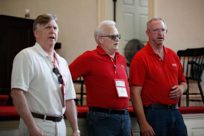 a group of men wearing red shirts