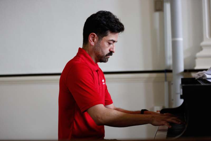 a man playing a piano