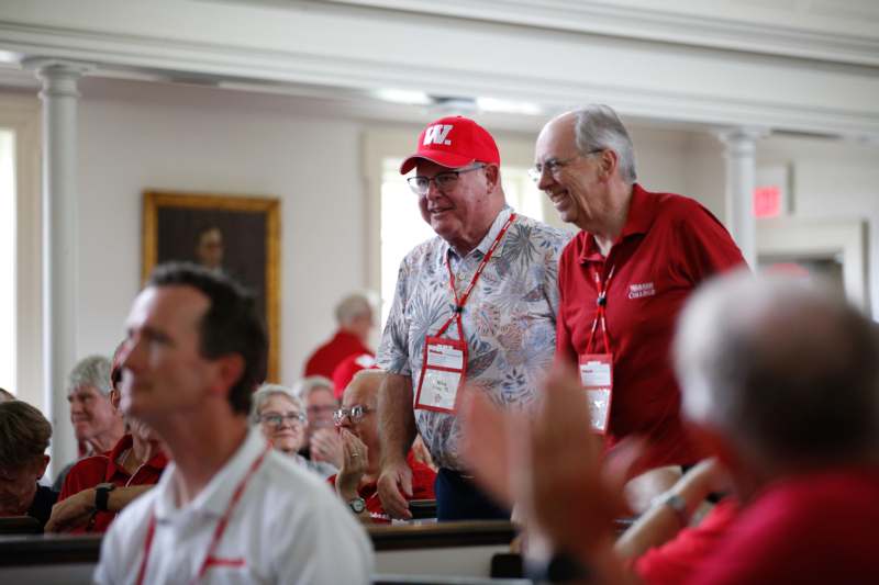 a group of men in red shirts and red hats
