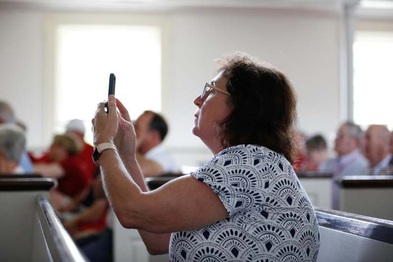 a woman holding a phone