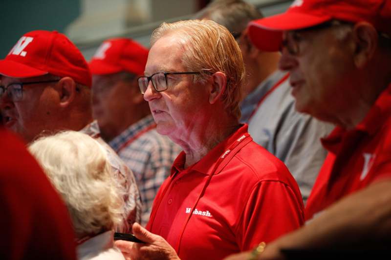 a group of people in red hats